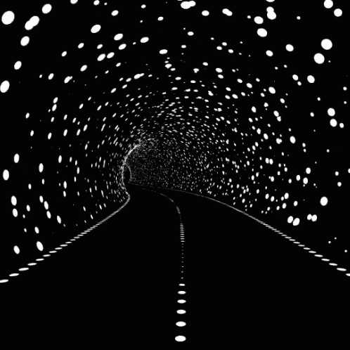 a train going through a tunnel with lights