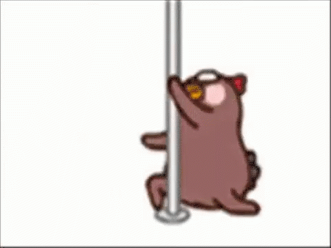 a small cartoon cat that is sitting under a pole