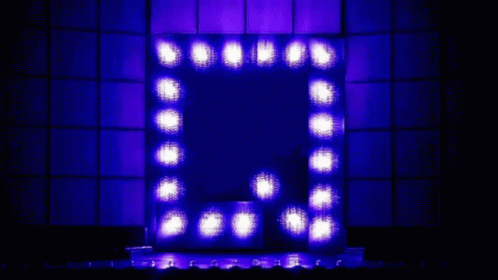a square lighted mirror with multiple lights on it