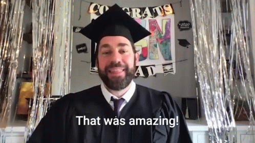 a man with beard and graduation outfit smiling