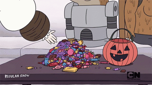a cartoon pumpkin sitting on top of a pile of candy