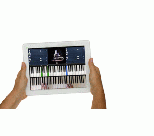 a hand is holding an ipad with keyboard keys