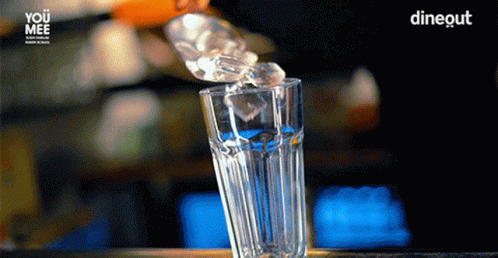 a crystal glass filled with water on a table