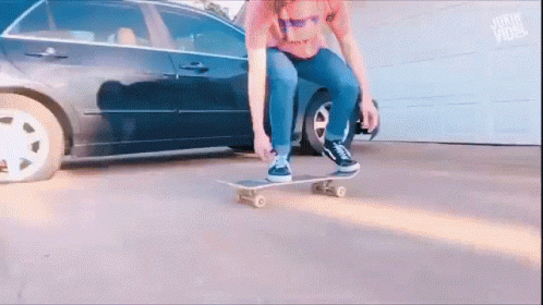a person riding a skate board on a street
