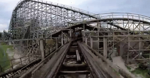 an old picture of roller coaster taken on the tracks