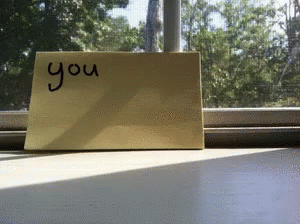 a note on a window sill with an you sign
