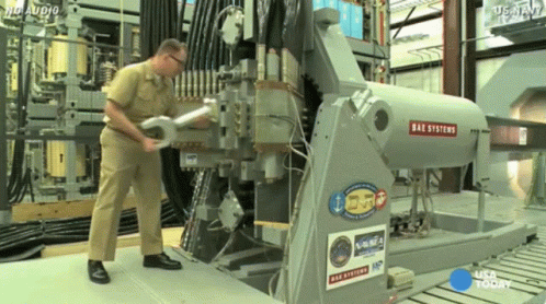 a man is working on an machine in a factory