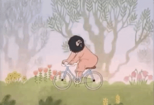 an animated image of a man riding a bike