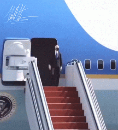 a set of stairs leading to an airliner