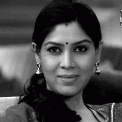 a black and white po of a woman in sari