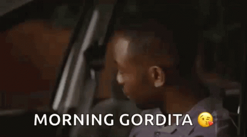 a man driving a car with the words morning gorillaia on it