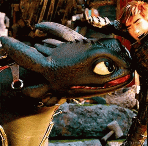 the blue eyes and green, black, and yellow dress of a dragon are seen
