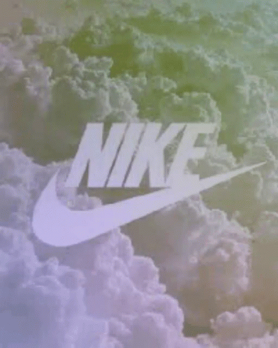 the nike logo is shown on top of some clouds