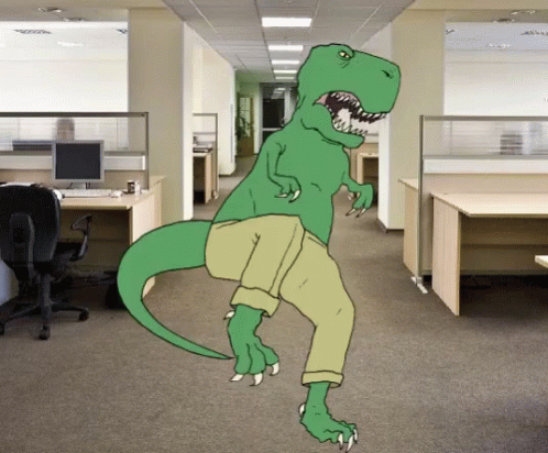 a dinosaur is in an office building with some computers on the desk