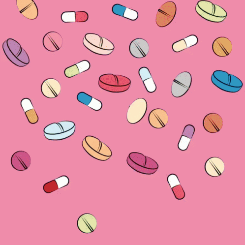a group of pills and capsules flying through the air
