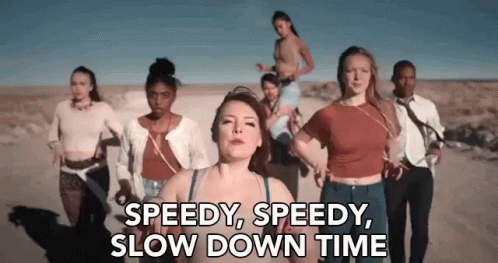 six women standing in front of a camera and the words speedy, speedy, slow down time