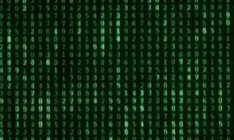 the image shows an abstract, dark background with numbers printed across it