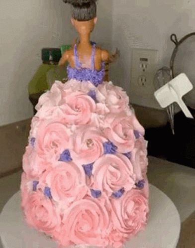 a white and blue cake with white roses on it