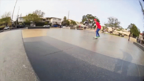 a man riding a skateboard on a cement ramp
