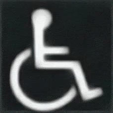 a handicap accessible sign with the symbol of a wheelchair on it