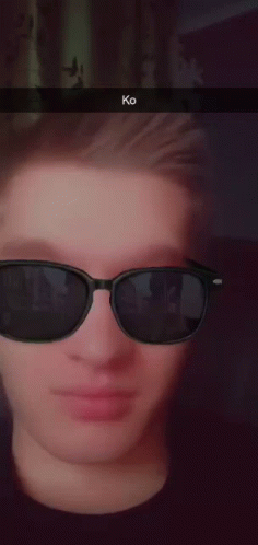 an image of a person's face with sunglasses