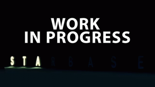 the word work in progress is lit up in the dark