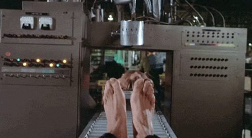 the person in a machine factory working on pants