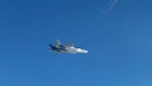 a single fighter jet flying through a sky