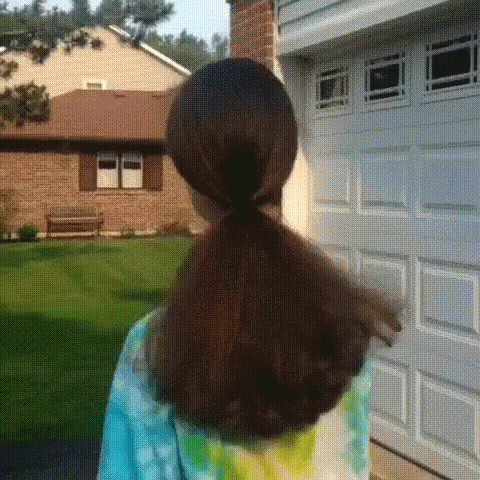 the back of a person with a tie dyed shirt