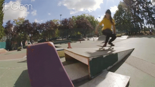 a skateboarder skating on a curved surface in the sun