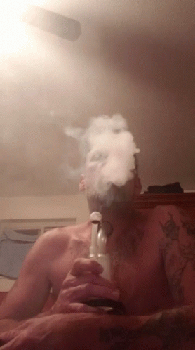 a man with a smokestatch sticking out of his mouth