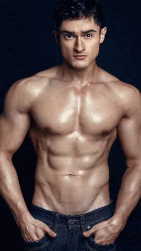 a man is shown in this po posing shirtless