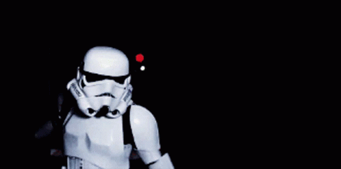 a clone trooper wearing a star wars helmet and a backpack