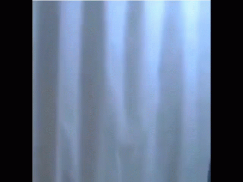 blurry image of white curtains as they can be seen