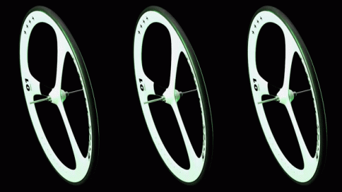 three green wheels are shown in a black background