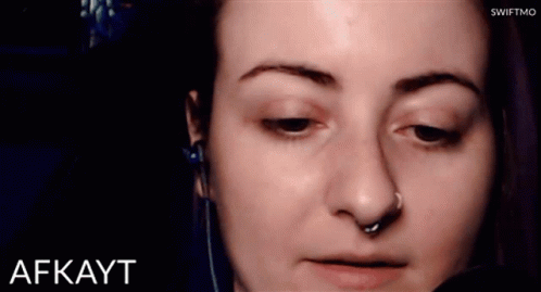 a picture of a woman wearing a creepy look with a nose ring