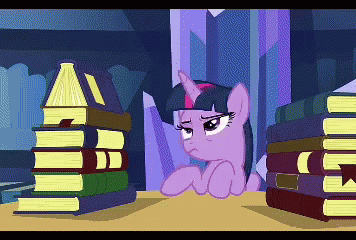 a pony is sitting next to a pile of books