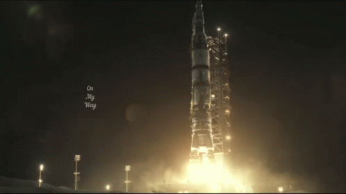 the launch of a rocket is seen on a foggy night