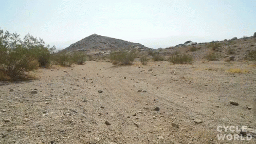 an outcropping is in the middle of a desert