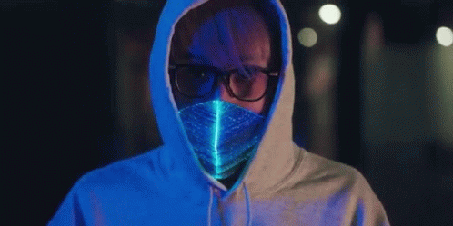 a guy with eye glasses wearing an orange and blue hoodie