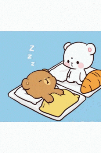 a cartoon bear is laying on a baby cot and an adult teddy is lying on the pillow