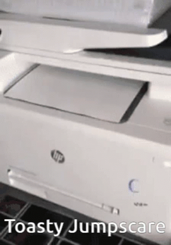 a white hp printer sitting on a black counter