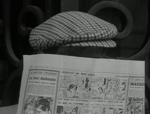 old newspaper on a bench with a checkered hat