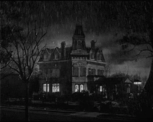 black and white image of a house in the dark