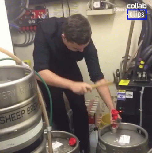 a man holding onto some gas and cleaning it