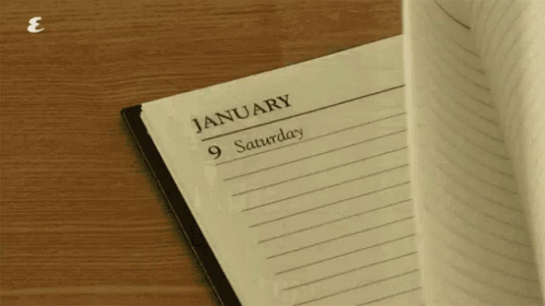 a piece of lined paper next to a calendar