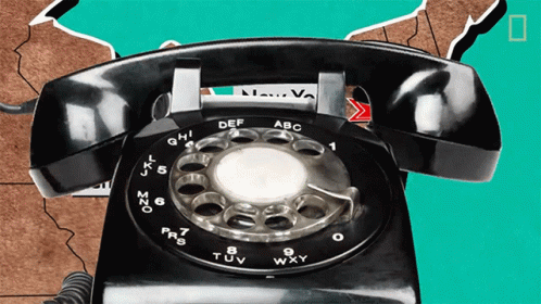 an old style telephone with two hands
