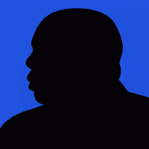 black silhouette of a man with an orange background