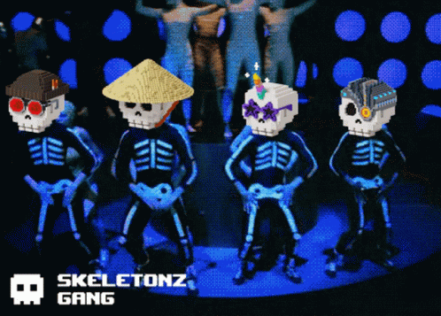 skeletons standing on a stage wearing day of the dead costumes