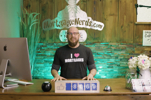 man in front of a wooden backdrop showing the numbers and an interesting image of a woman